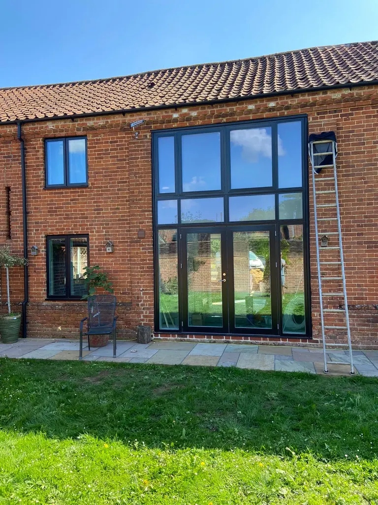 Brick barn with new full-height rear glazing